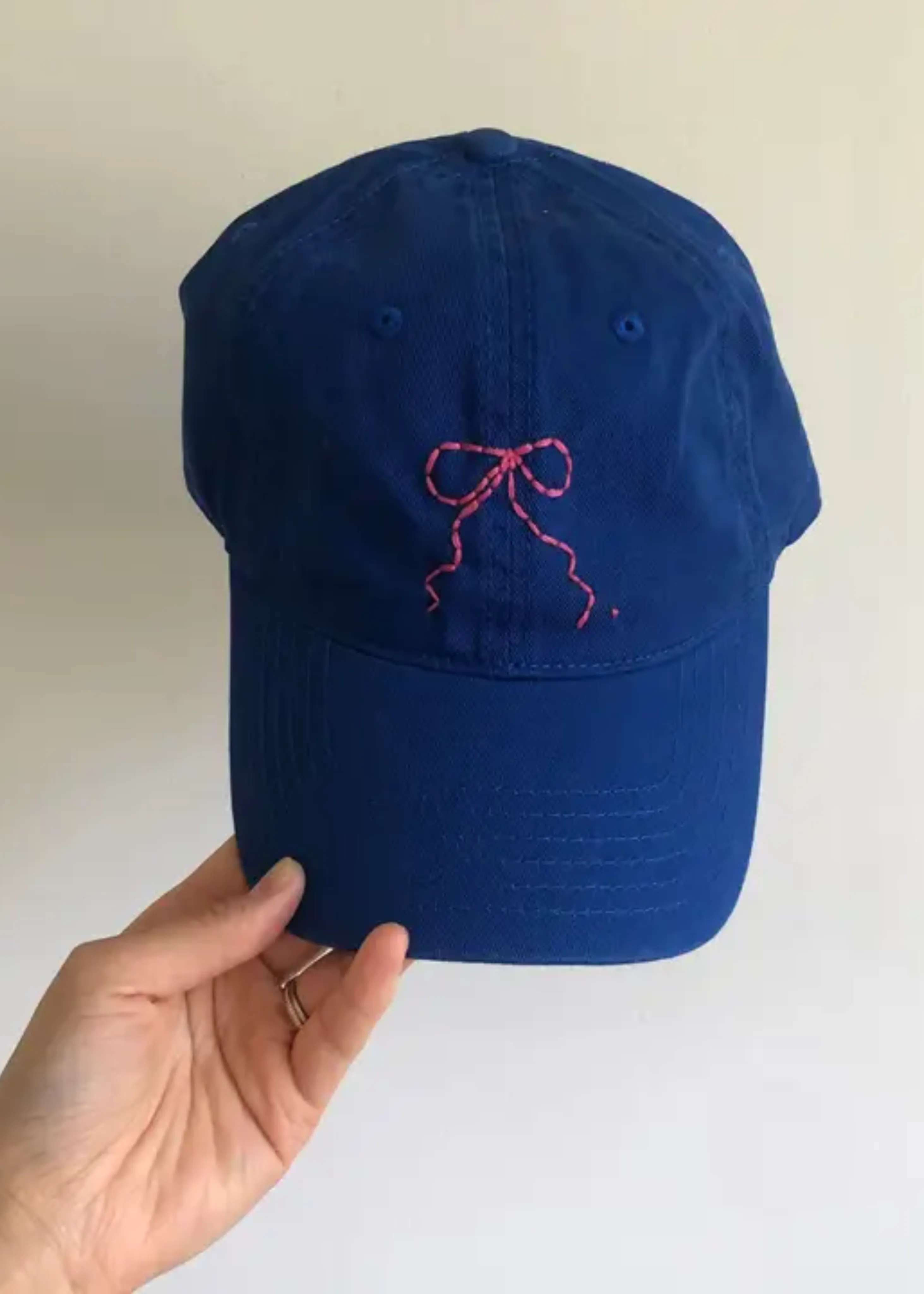 Hand embroidered bow caps, blue